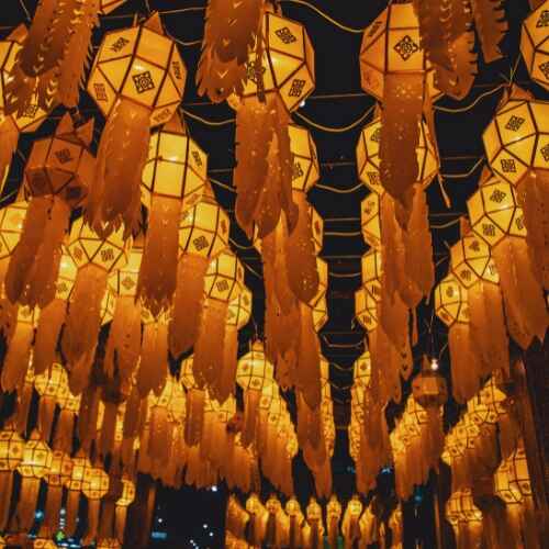 Traditional illuminated lanterns hanging at a night festival in Thailand, featured in the Chiang Mai Digital Nomad Guide.