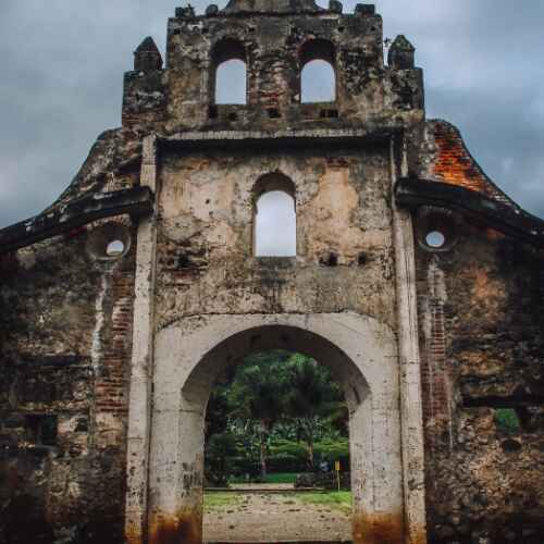 Historic stone ruins surrounded by nature featured in a Costa Rica ecotourism guide.